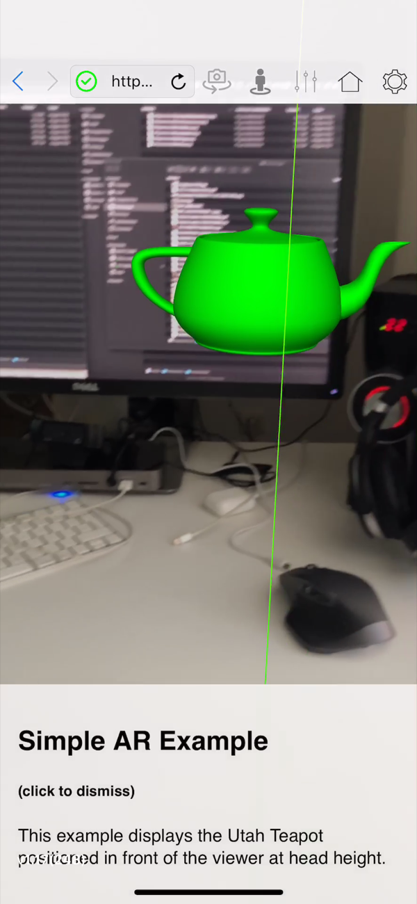 The teapot example seen head-on, the object steady in front of the monitor behind it