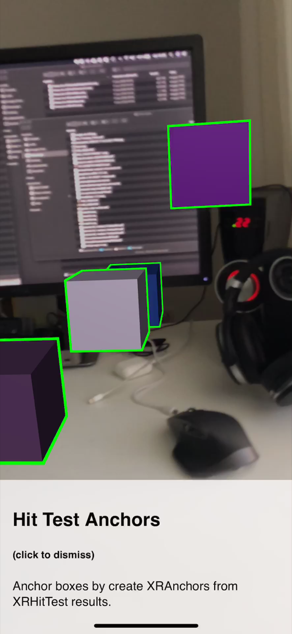 Cubes anchored at several depths across the desk, seen from further back